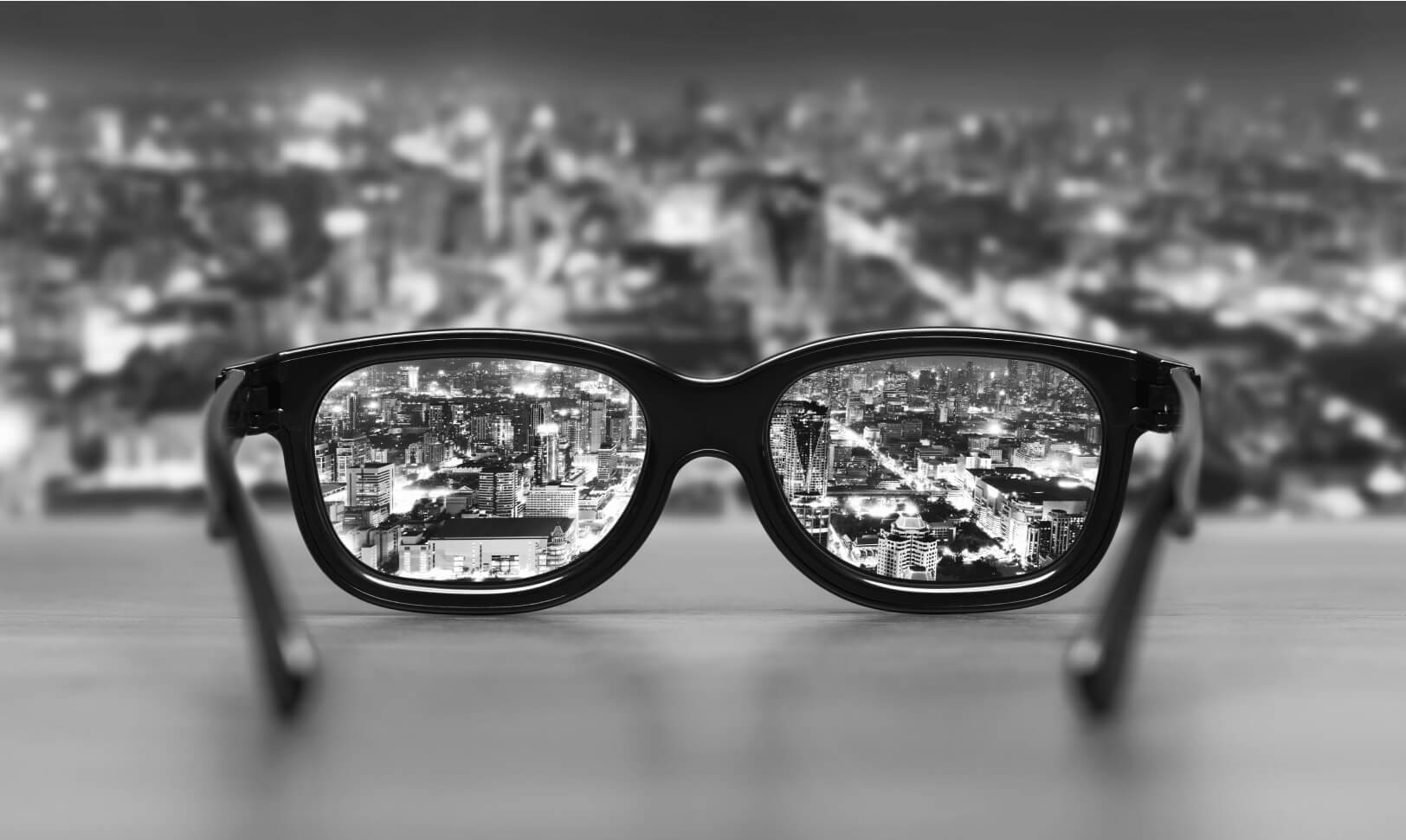 glasses with city skyline in the background